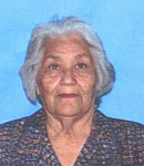 Photo of Rita Morales. She is an elderly woman with gray hair and light-brown skin, wearing a brown collared shirt.