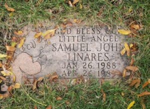 Photo of Samuel Linares's gravestone, reading, Samuel John Linares, January 26, 1988 to April 26, 1989.