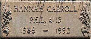 Grave plaque reading, "Hannah Carroll, Phillippians 4:13, 1986 to 1992."