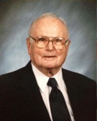 Photo of Theodore Meyer, an elderly white man in a suit and black tie, wearing glasses.
