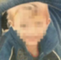 Photo of a small boy, with a censor blur obscuring the face. The child has blond hair and fair skin and is wearing a blue hoodie.