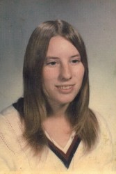 Portrait photo of Karen Passmore. She is a young woman with straight light-brown hair.