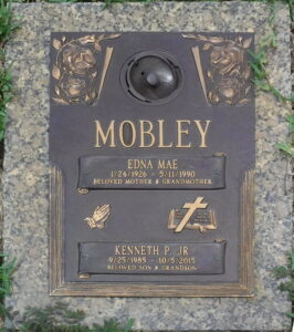 Gravestone reading Mobley, Edna Mae, 1/24/1926-5/11/1990, beloved mother and grandmother; Kenneth P. Jr, 8/25/1985-10/5/2015, beloved son & grandson.
