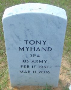 Photo of a white marble gravestone reading, "Tony Myhand, SP4 US Army, Feb 7 1957 to Mar 11 2016."