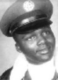 Photo of Willie Henderson. He is a young African-American man wearing an Air Force uniform.
