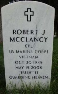 Photo of a gravestone. It reads: Robert J McClancy. Corporal, US Marine Corps. Vietnam. Oct. 20, 1949. May 15, 2006. "Irish" is Guarding Heaven."