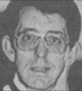 Black and white newspaper photo of Henry Wilson, a middle-aged man with dark hair, light skin, and glasses.