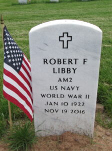 White marble gravestone reading, "Robert F Libby, AM2, US Navy, World War II, Jan 10, 1922 November 19 2016."