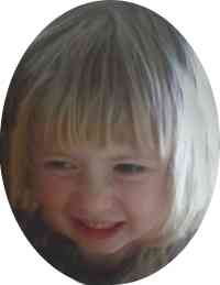 Photo of Amber Perry, a toddler girl with fair skin and light blonde hair, smiling into the camera.