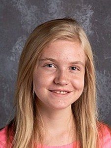 School photo of Jessica Cunningham, a teenage girl with long blonde hair and fair skin, wearing a peach T-shirt.