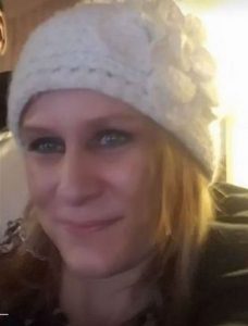 Photo of Vanessa Danielson, a woman with fair skin and blonde hair, wearing a white knit cap. The photo is somewhat blurry and backlit.