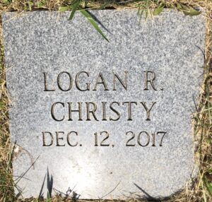 Gravestone reading, Logan R. Christy, Dec. 12, 2017.
