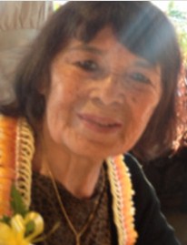 Photo of Josephine Leong, an older woman with chin-length brown hair and freckled tan skin.