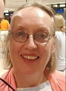 Photo of Marcia Neigebauer, a woman with fair skin, blonde hair, and glasses.