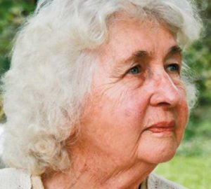 Photo of Mary White, an elderly woman with chin-length white hair, fair skin and blue eyes. She is photographed in profile and has a thoughtful expression on her face.