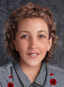 Composite image of Peggy Lynn Johnson, a young woman with very curly blond hair, a small nose, pointed chin, and hazel eyes.