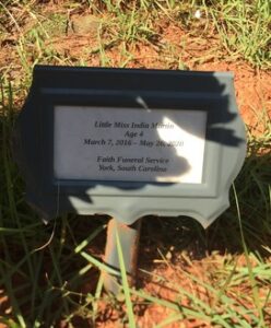 Temporary grave marker for "Little Miss India Martin, Age 4, March 7, 2016 - May 26, 2020"