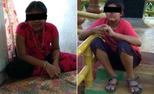 Photo: Two images side by side; the first of a girl with tan skin and dark hair in braids, wearing a red dress and gold necklace and bracelets; she is sitting on a rug. The second photo is of a boy sitting on some stairs, wearing sandals, red shirt and blue shorts; he also has dark hair and brown skin. The children have censor bars across their eyes to protect their identities.