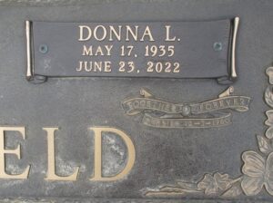 Photo of a gravestone, reading Donna L, May 17, 1955 to June 23, 2022, together forever.